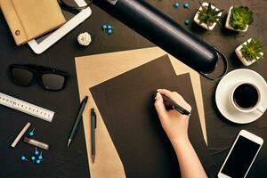 Architect working on blueprint. Architects workplace - architectural project, blueprints, tablet pc. Engineering tools. Top view photo