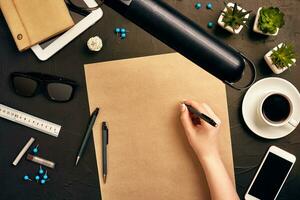 Architect working on blueprint. Architects workplace - architectural project, blueprints, tablet pc. Engineering tools. Top view photo