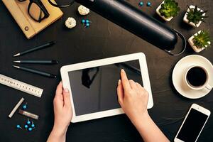 Architect working on blueprint. Architects workplace - architectural project, blueprints, tablet pc. Engineering tools. Top view photo