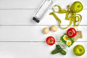 lunch box with healthy food. Eggs, vegetables, fruits. photo