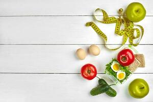 lunch box with healthy food. Eggs, vegetables, fruits. photo