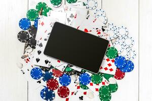 Post blog social media poker. Banner template layout mockup for online casino. Wooden white table, top view on workplace. photo