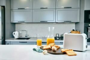 Continental breakfast - orange juice and toast on white table. photo