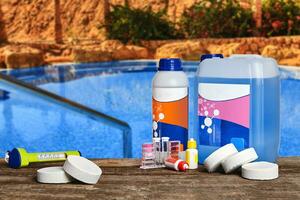 Equipment with chemical cleaning products and tools for the maintenance of the swimming pool. photo