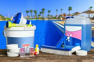 Equipment with chemical cleaning products and tools for the maintenance of the swimming pool. photo