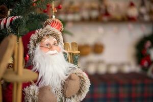 Santa Claus doll in Christmas decoration. photo