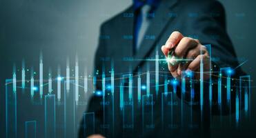 Businessman pen graph stock market and forex exchange data  index future chart with analysis financial fund price hologram virtual screen photo
