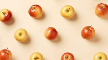 Pattern of red and yellow apples on beige background, top view Generative AI photo