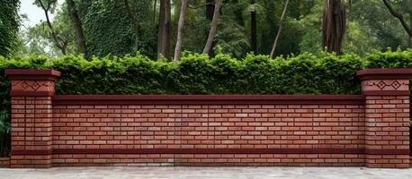 Red brick fence with modern decorative columns photo