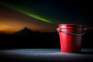 un rojo Cubeta con un Aurora en el antecedentes. generado por ai foto