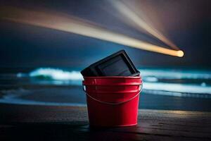 a red bucket sitting on the beach with a flashlight. AI-Generated photo