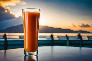 a glass of orange juice on a table in front of the ocean. AI-Generated photo