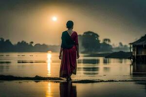 a woman in a red sari walks along the shore at sunset. AI-Generated photo