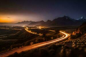 a long exposure photo of a road and mountains at night. AI-Generated