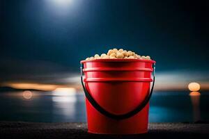 un Cubeta de palomitas de maiz en el playa a noche. generado por ai foto