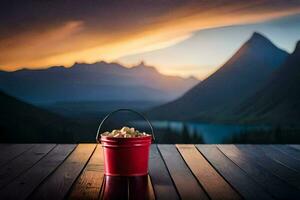 a bucket of popcorn on a wooden table in front of a lake. AI-Generated photo