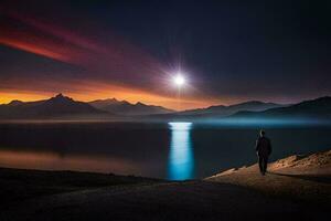 un hombre en pie en un colina con vista a un lago a puesta de sol. generado por ai foto