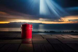 a red bucket sitting on a wooden floor with a sunset in the background. AI-Generated photo