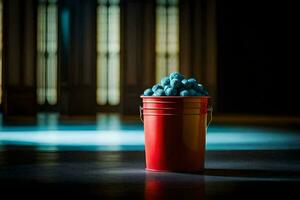 a red bucket filled with blueberries sitting on a floor. AI-Generated photo