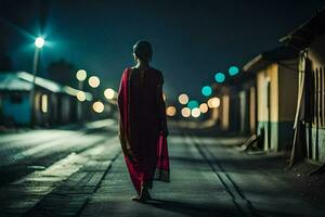 un mujer en un rojo sari camina abajo un calle a noche. generado por ai foto