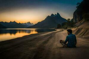 un hombre sentado en el playa a puesta de sol. generado por ai foto