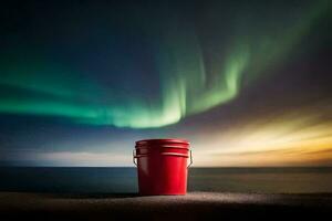a red bucket sits on the ground in front of an aurora. AI-Generated photo
