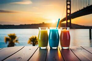 three glasses of juice with a bridge in the background. AI-Generated photo