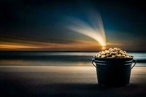 a bucket of peanuts on the beach at sunset. AI-Generated photo