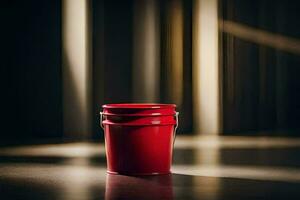 a red bucket sitting on a table in the dark. AI-Generated photo
