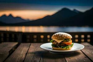 a hamburger on a plate with mountains in the background. AI-Generated photo