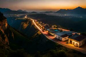 a view of a village at dusk with a road winding down the side of a mountain. AI-Generated photo