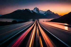 a long exposure photograph of a highway with mountains in the background. AI-Generated photo