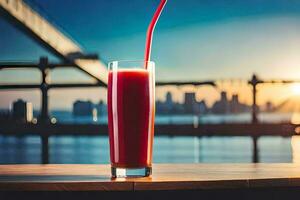 a glass of juice with a straw in front of a city skyline. AI-Generated photo