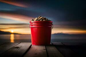 un rojo Cubeta lleno con nueces en un de madera mesa. generado por ai foto