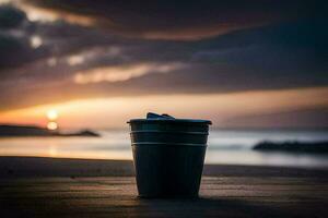 un el plastico taza se sienta en el playa a puesta de sol. generado por ai foto