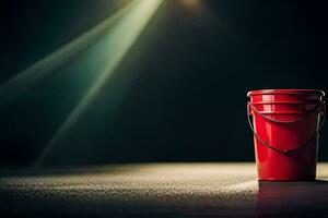 a red bucket sitting on a table in front of a spotlight. AI-Generated photo