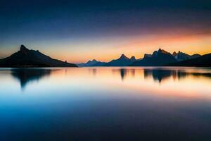 el montañas son reflejado en el agua a puesta de sol. generado por ai foto