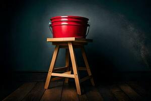 a red bucket on a wooden stool in a dark room. AI-Generated photo