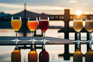 five glasses of different colored juices are lined up on a table. AI-Generated photo