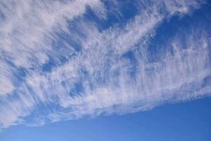 a blue sky with clouds in the distance photo