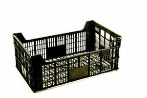 a black plastic crate with a mesh top photo