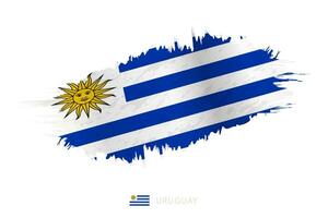 Painted brushstroke flag of Uruguay with waving effect. vector
