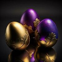 three golden eggs with purple and gold decorations photo