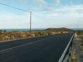 a road with a blue sky photo