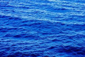 the ocean is blue and has ripples photo