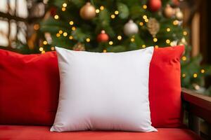 Blank white pillow mockup on red sofa with christmas tree and lights bokeh background. Holiday template composition with decoration. Copy space. photo