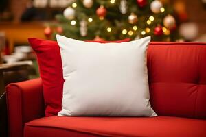 Blank white pillow mockup on red sofa with christmas tree and lights bokeh background. Holiday template composition with decoration. Copy space. photo