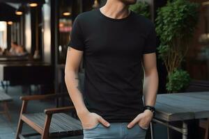 Young man wearing bella canvas black t shirt and jeans, at a cozy restaurant on summers day. Design tshirt template, print presentation mockup. Ai generated. photo