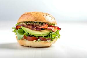 Fresh bagel with bacon, avocado, tomatoes and green salad on white table, light background. Copy space. AI generated. photo