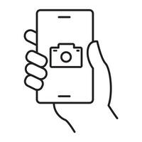 An icon illustrating a smartphone with a camera icon on the screen, emphasizing smartphone camera mode, handheld photography, a mobile photography app, and a camera function display. vector